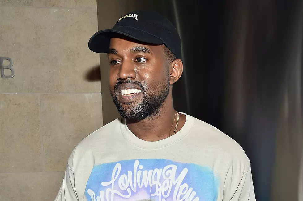 Fans Predict Kanye West Has New Music on the Way After Photo Surfaces of Him Smiling With Laptop in Hand