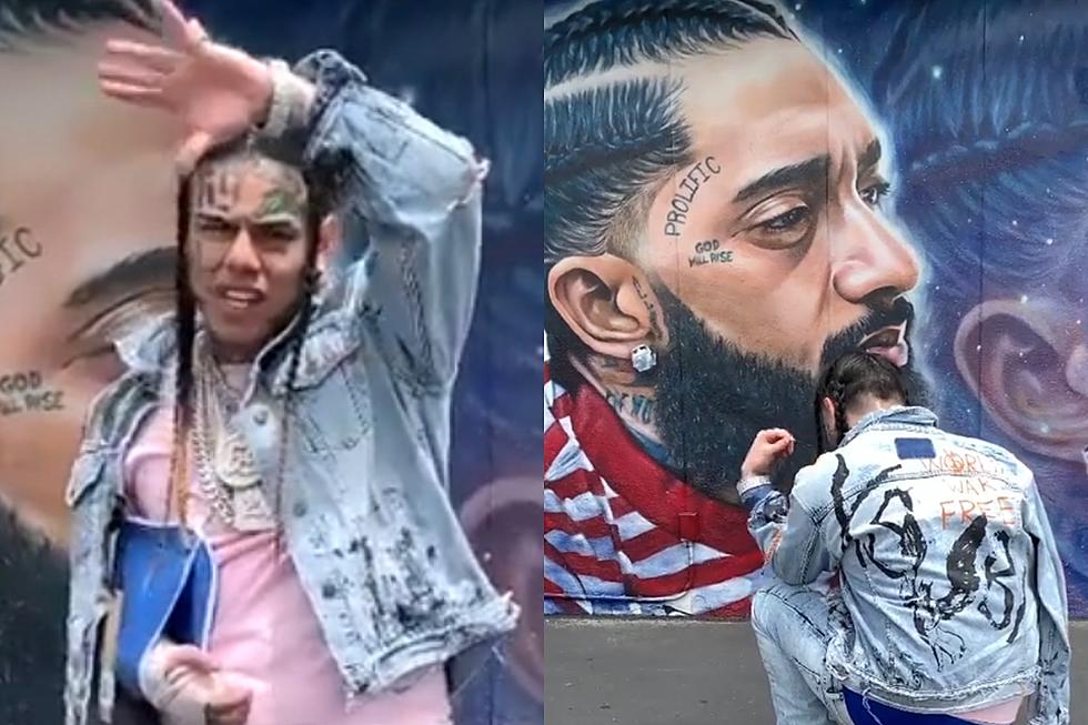 6ix9ine Gets Dragged After Kneeling in Front of Nipsey Hussle Mural