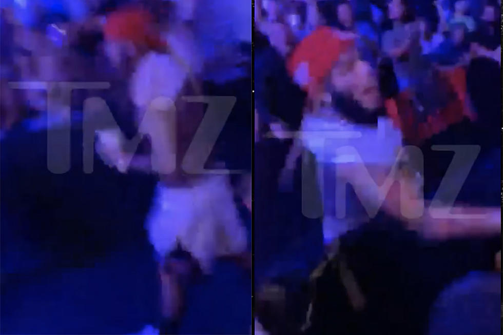 6ix9ine Gets Hit With Drink Thrown at Him, Throws His Drink Back During UFC Fight – Watch
