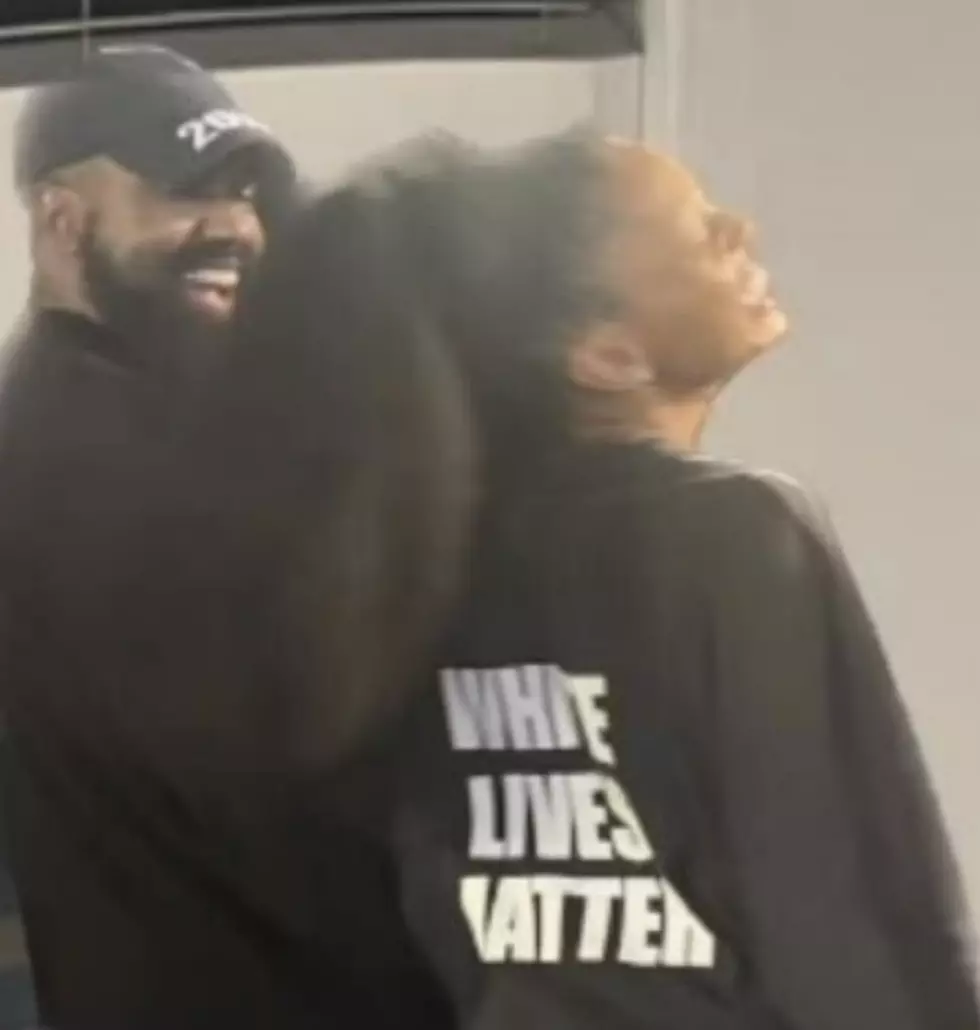 Selah Marley wears White Live Matter shirt with Kanye West at fashion show.