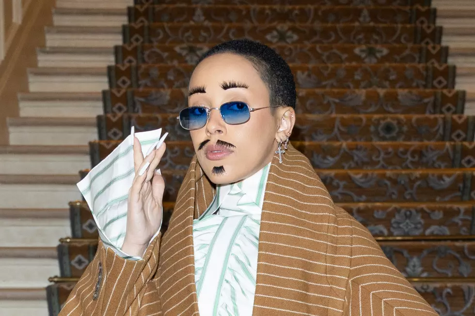Doja Cat Wears Fake Facial Hair After Fans Clowned Her for Shaving Her Eyebrows