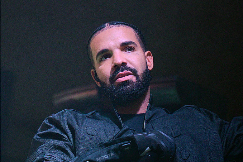 Drake Wears an Angry Bulldog Mask While Leaving Hotel - XXL