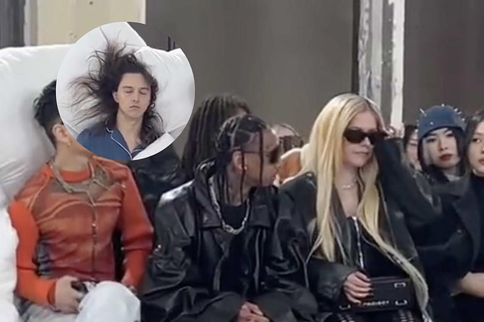 Tyga and Avril Lavigne Spotted Next to Man Dressed as a Bed at Paris Fashion Week – Watch
