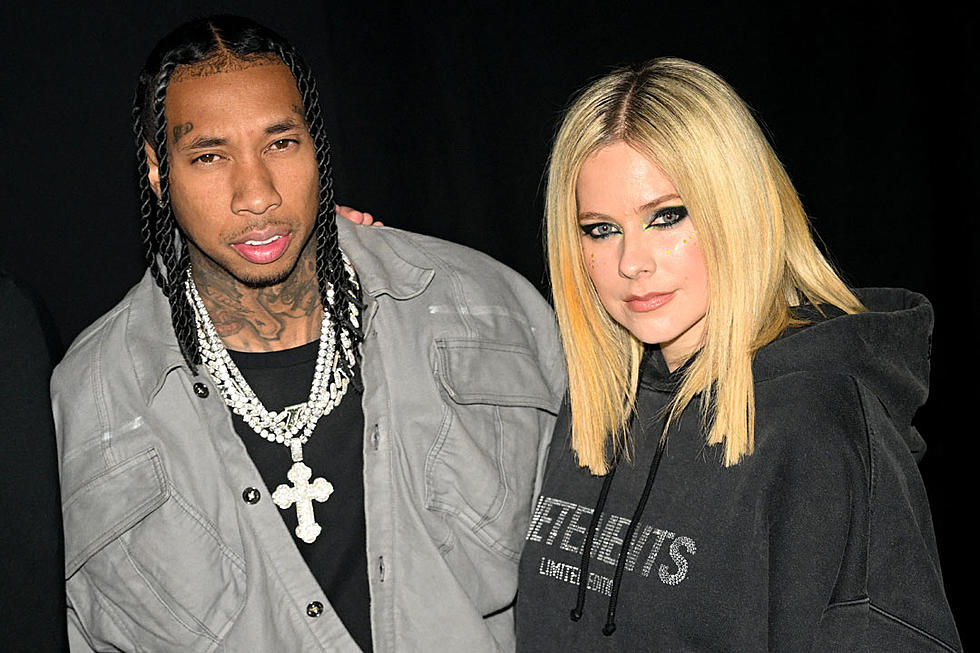 Tyga and Avril Lavigne Kiss, Confirm Dating at Paris Fashion Week Event