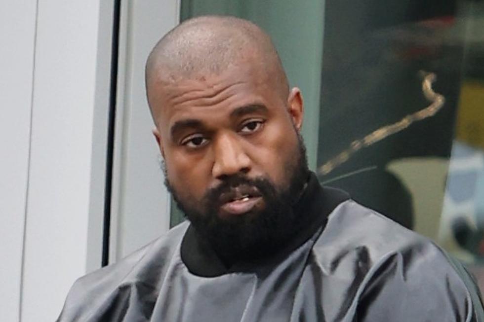 Kanye West Spotted in German Police T-Shirt With Shoulder Pads and Blue Sock Shoes, Fans React