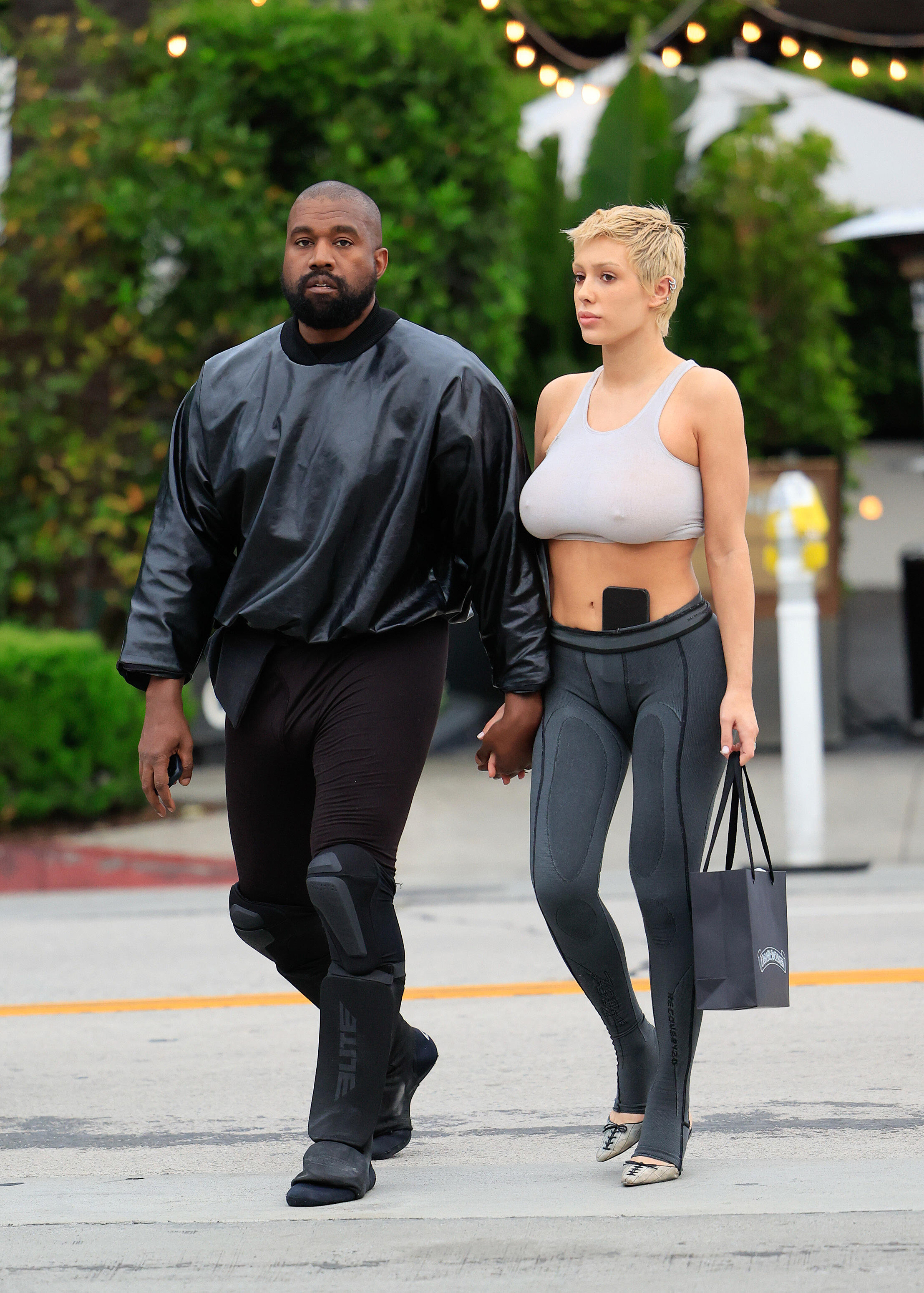 Kanye West wears knee-length fur coat in New York
