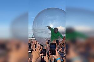 Akon Crowd-Surfs Inside Giant Plastic Bubble During Performance...