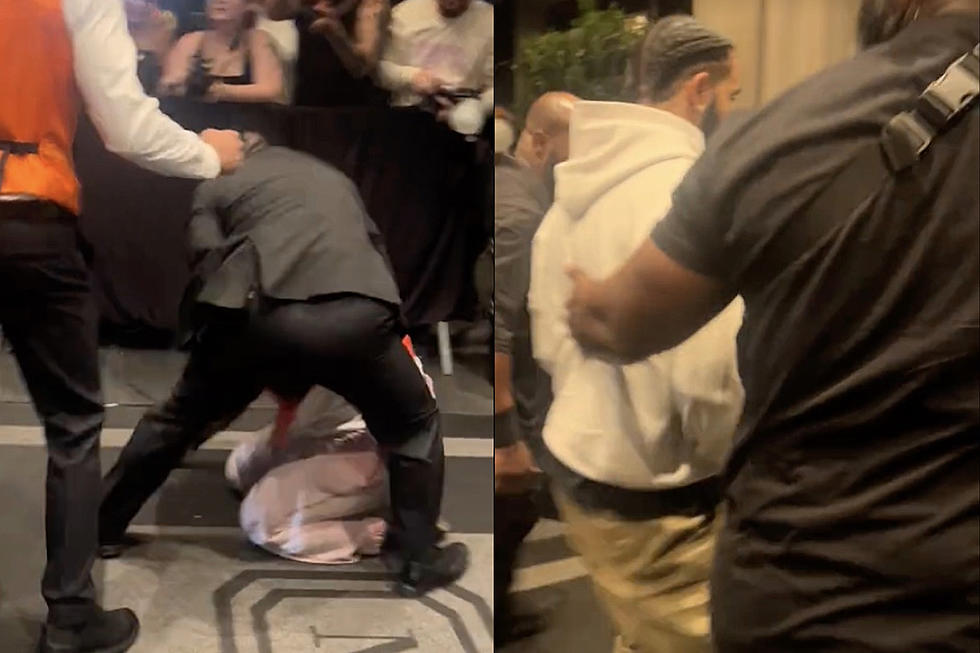 Drake Fan Grabbed by Security as She Jumps Over Barricade to Get Close to Drake at His Hotel