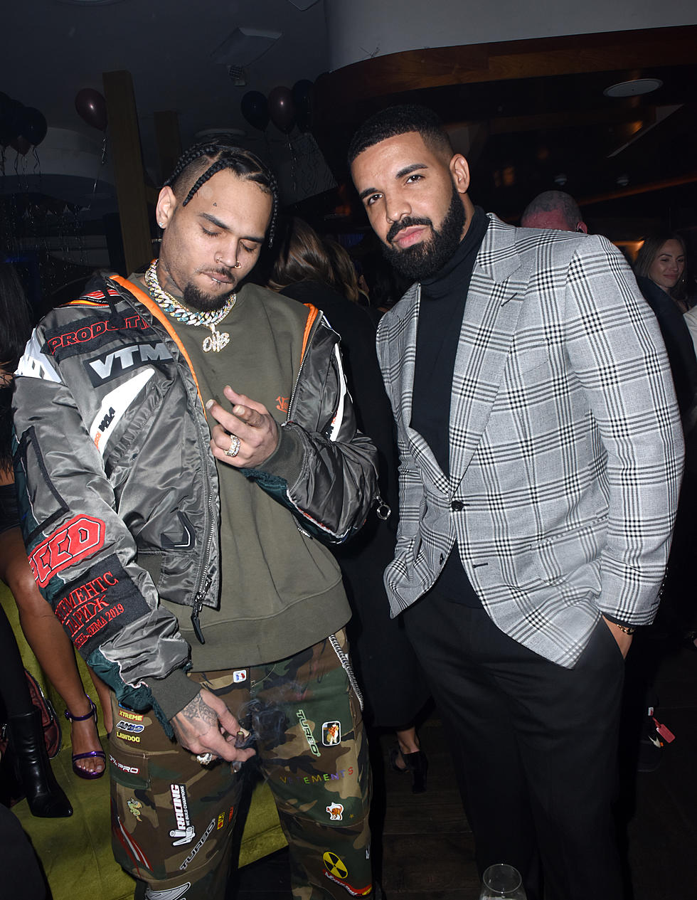 LOS ANGELES, CA - DECEMBER 31:  Chris Brown and Drake attend The Mod SÃ¨lection Champagne New Years Party Hosted By Drake And John Terzian at Delilah on December 31, 2018 in Los Angeles, California. 