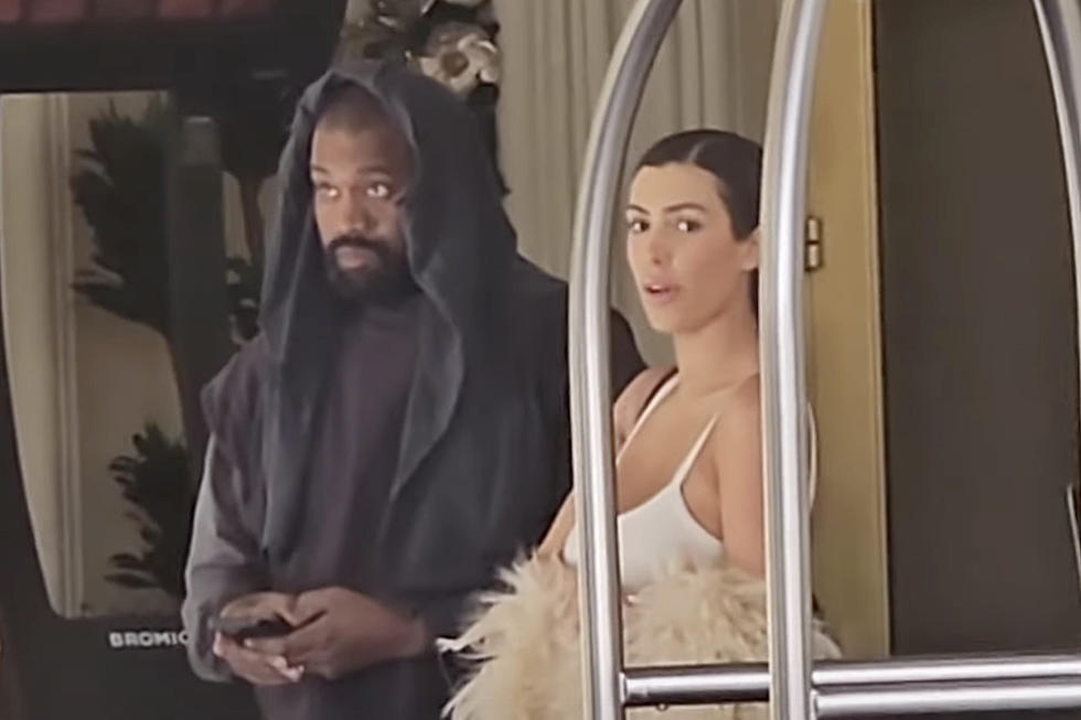 Kanye West Posts Semi-Nude Photos of Wife In Latex Face Mask