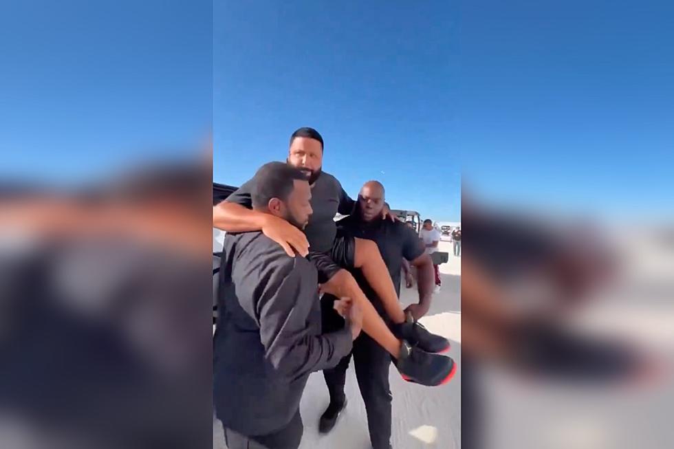 DJ Khaled’s Two Security Guards Carry Him in Their Arms so His New Jordans Don’t Get Dirty