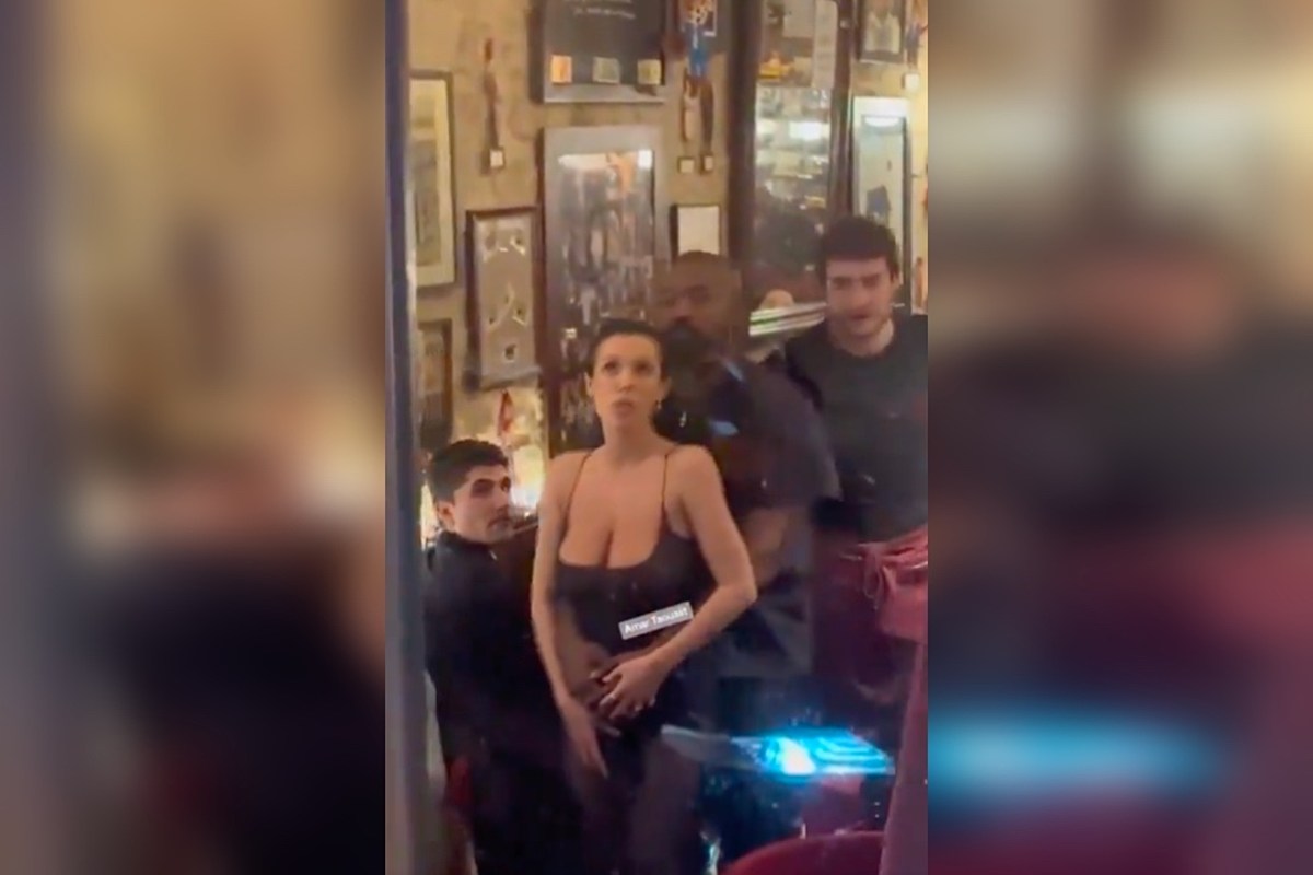 Watch: Woman rubs bare breasts on man's face
