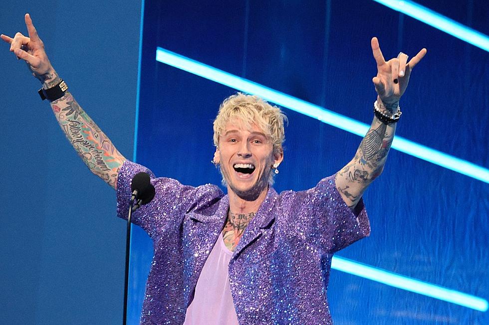Why Machine Gun Kelly Covers Most of His Tattoos With Black Ink