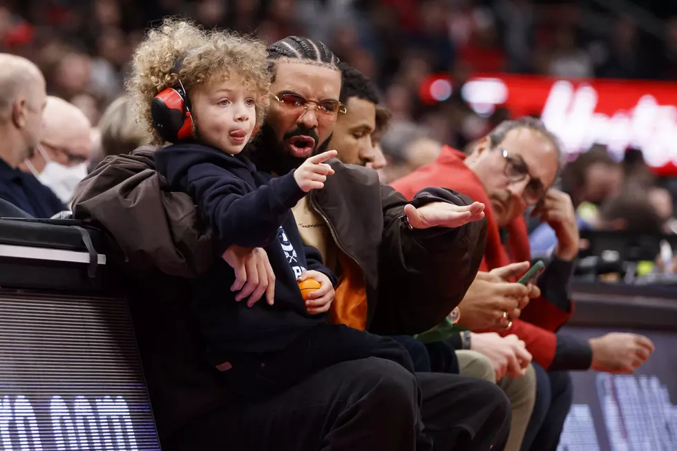 Rapper Drake and his son Adonis take in the Game Six of the Eastern Conference First Round between the Toronto Raptors and the Philadelphia 76ers at Scotiabank Arena on April 28, 2022 in Toronto, Canada.