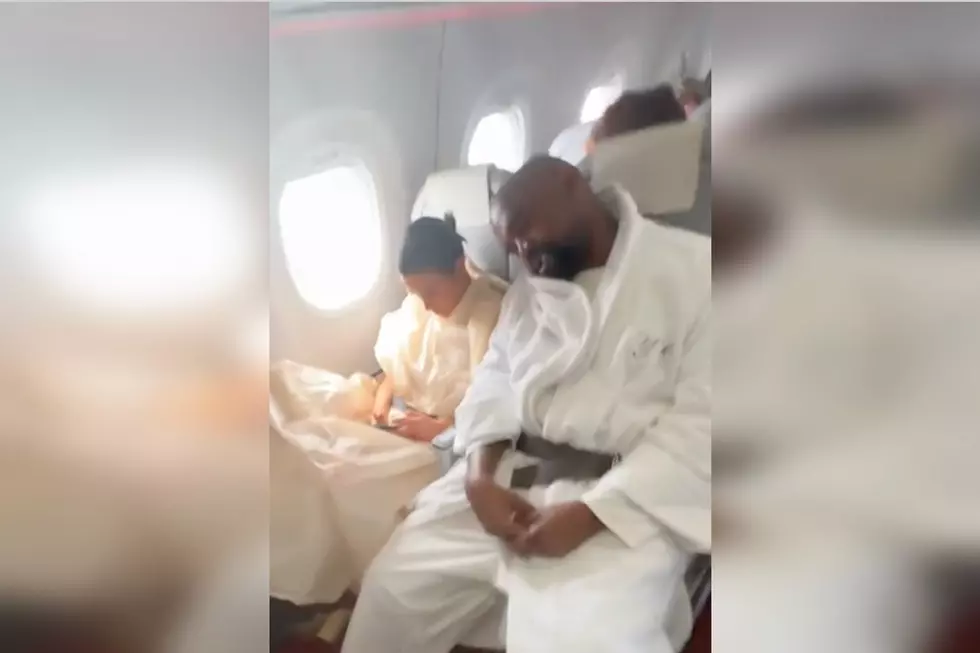 Fan Catches Ye Sleeping in a Bathrobe on a Plane