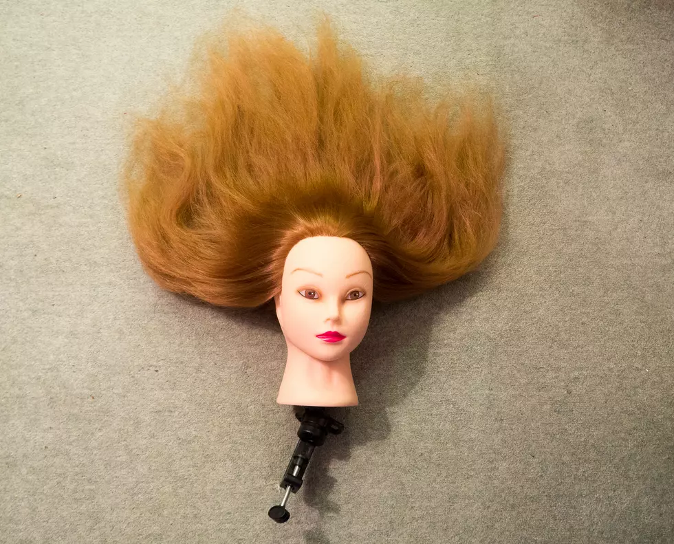 Girls World type dolls head on a beige carpet