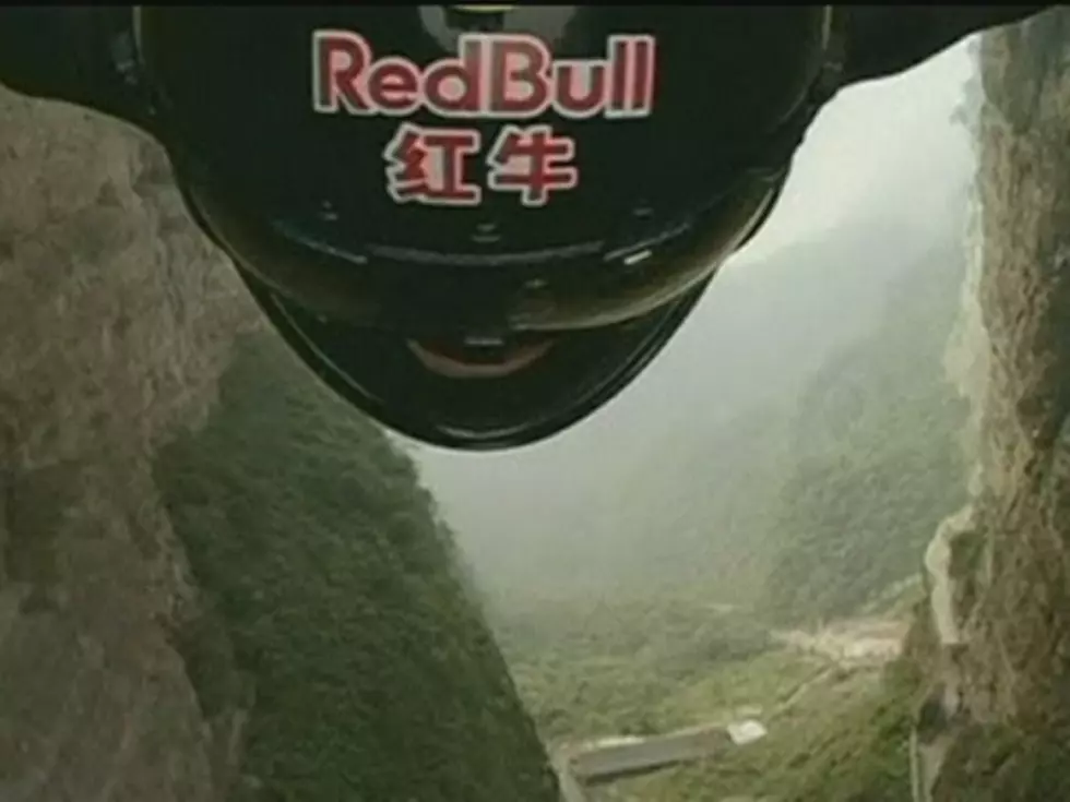 Wingsuit Diver Flies Through A Mountain