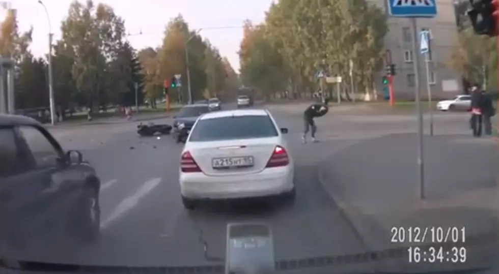 Man Lands on His Feet After Crashing Motorcycle [VIDEO]