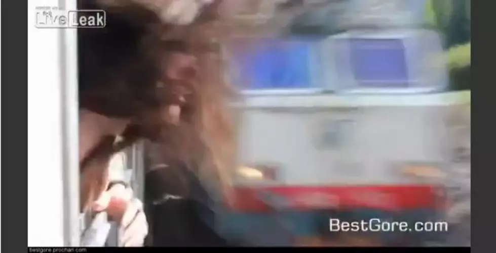 Woman Nearly Gets Head Taken Off By Train [VIDEO]