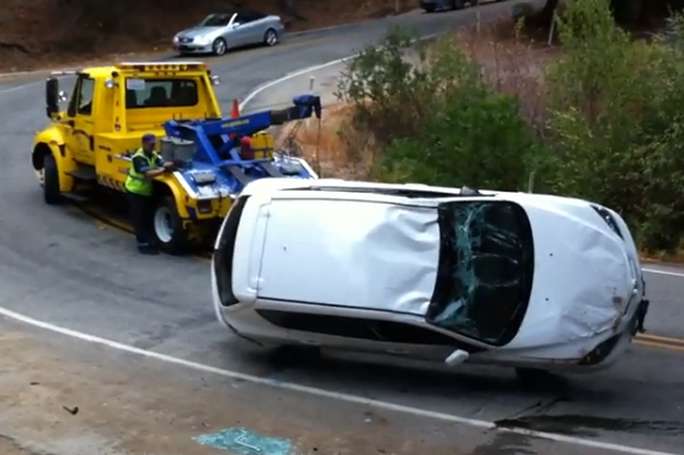Tow Truck Driver Flip Car on It’s Side Into a Ditch [VIDEO]