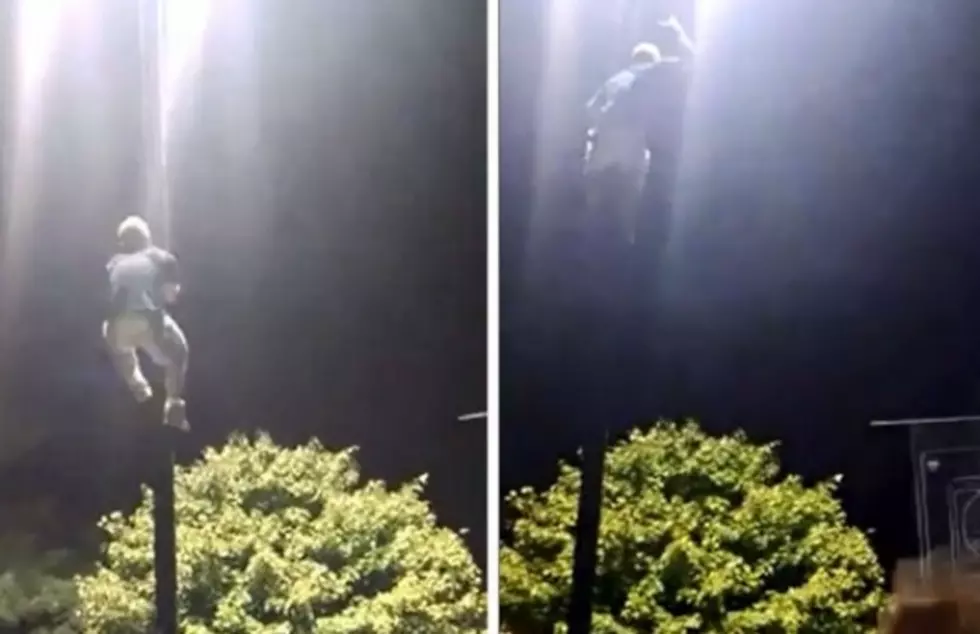 Crazy Dude Climbs Light Pole During Killswitch Engage at Dirt Fest [VIDEO]