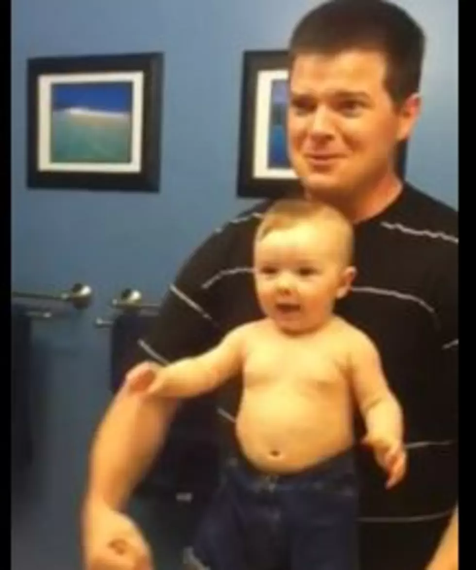 Baby Imitates Dad By Flexing His Muscles In Mirror [VIDEO]
