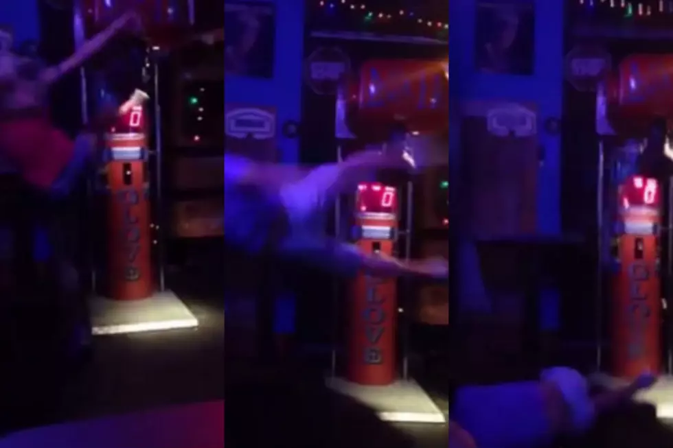 Drunk Tries To Kick Punching Bag Game, Gets Knocked Out [VIDEO]