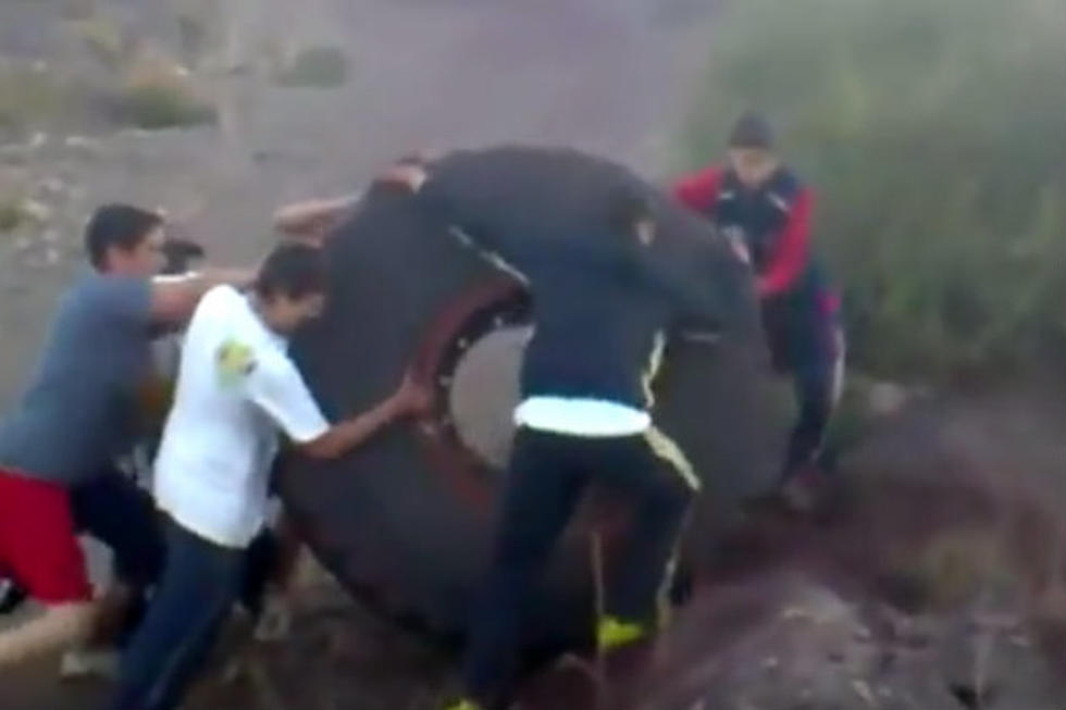 Bored Dudes Roll 800 Pound Tire Down Hill Into Lake [VIDEO]