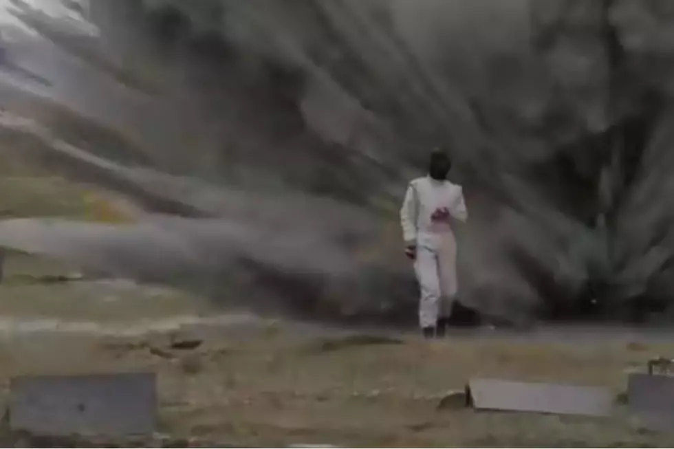 Woman Walks Through Field Of Fire And Explosives [VIDEO]