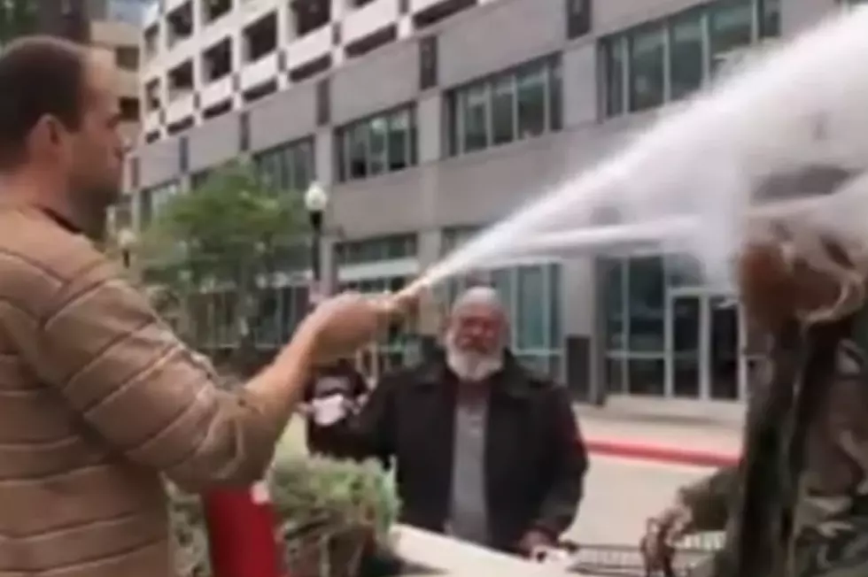 Man Sprays Cigarette Smoker In Face With Fire Extinguisher [VIDEO]