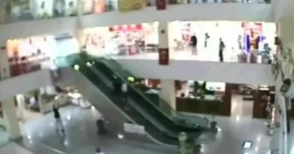 Man Catches A Kid Falling Off Of An Escalator [Video]
