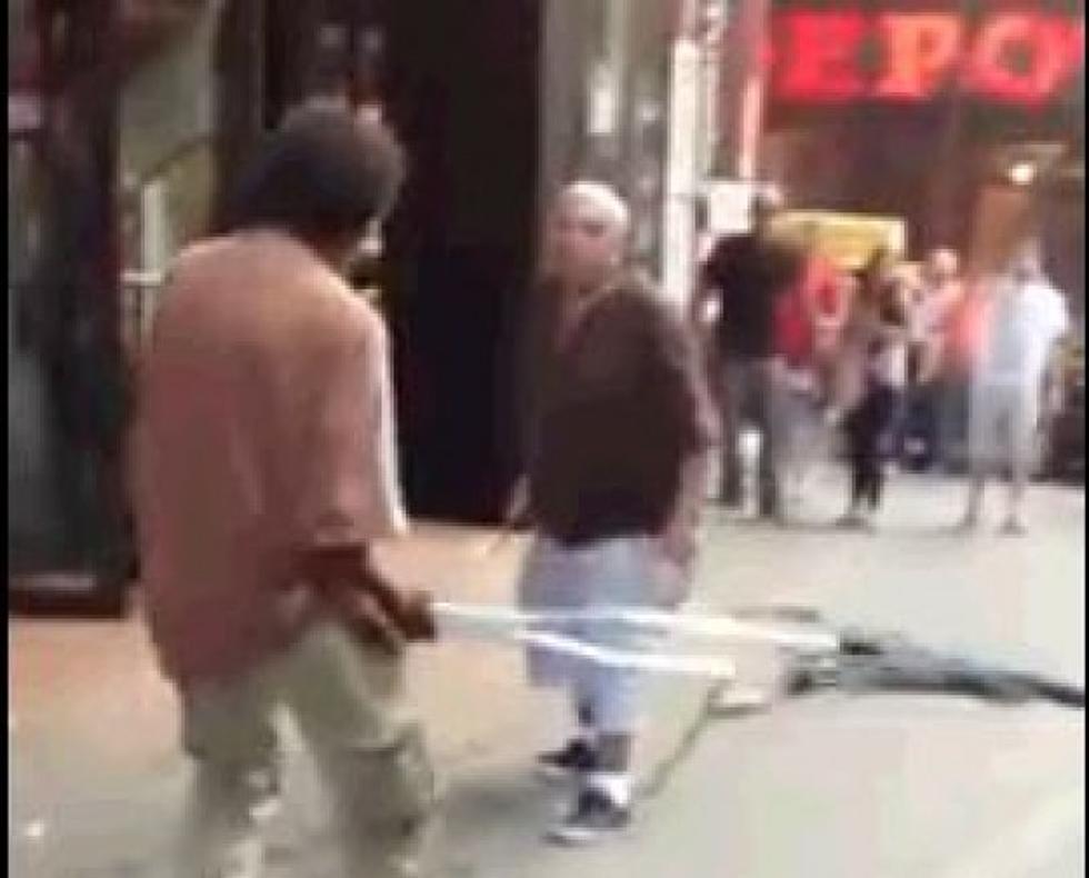 Crutch Duel Gets Ugly In Time Square [Video]