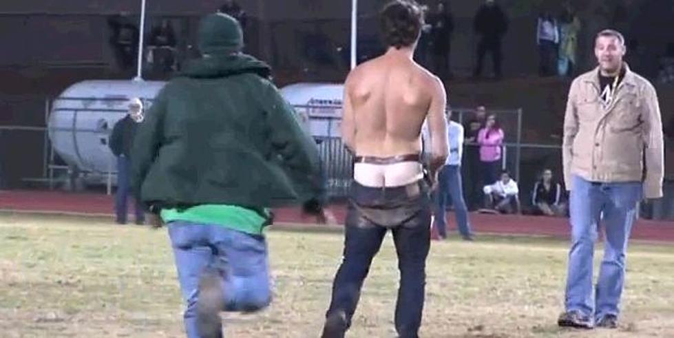 Guy Threatens High School Football Players On The Field, Gets Taken Out By Their Dads [Video]