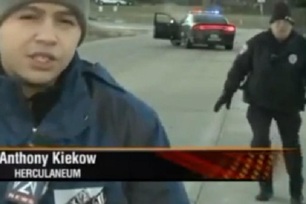 Cop Caught In Live News Shot Has A Hilarious Reaction [Video]