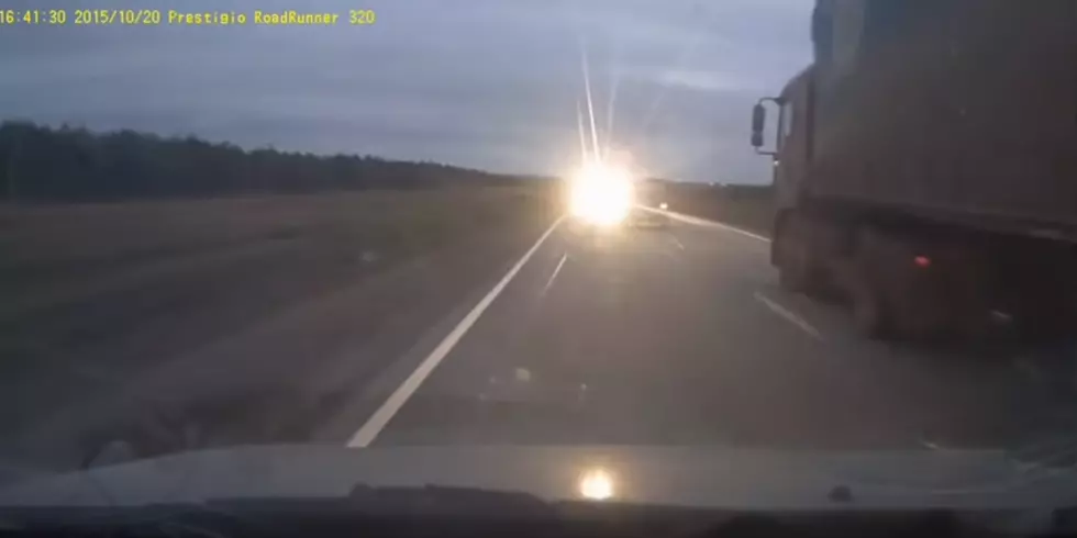Idiot Almost Dies While Trying To Pass Semi [Video]