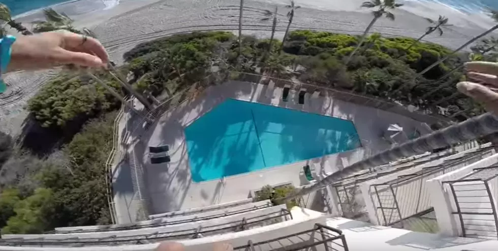 Adrenalin Junkie Jumps From Top Of Hotel Into Pool [Video]
