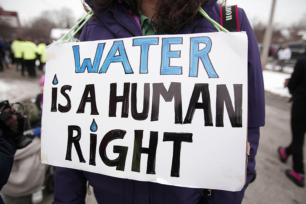 Flint Residents Marching To City Hall For The Three Year Anniversary Of The Flint Water Crisis