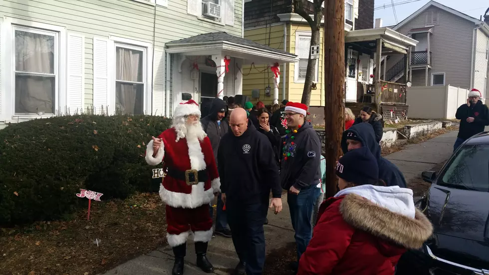 Police and Fire Department Escort Santa Making Special Deliveries