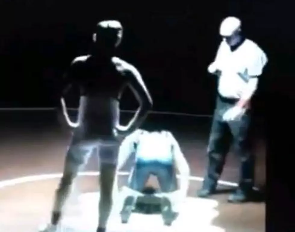 High School Wrestler Knocked Out By Falling Light [VIDEO]