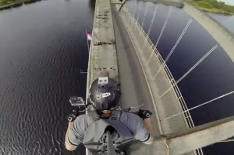 Daredevil Motorcyclist Crosses Bridge in Unique Way [Video]