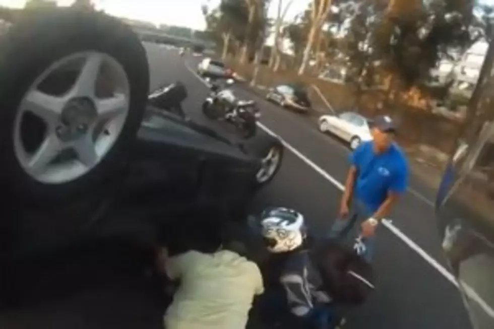 Motorcyclist Saves Driver Trapped in Overturned Car [Video]