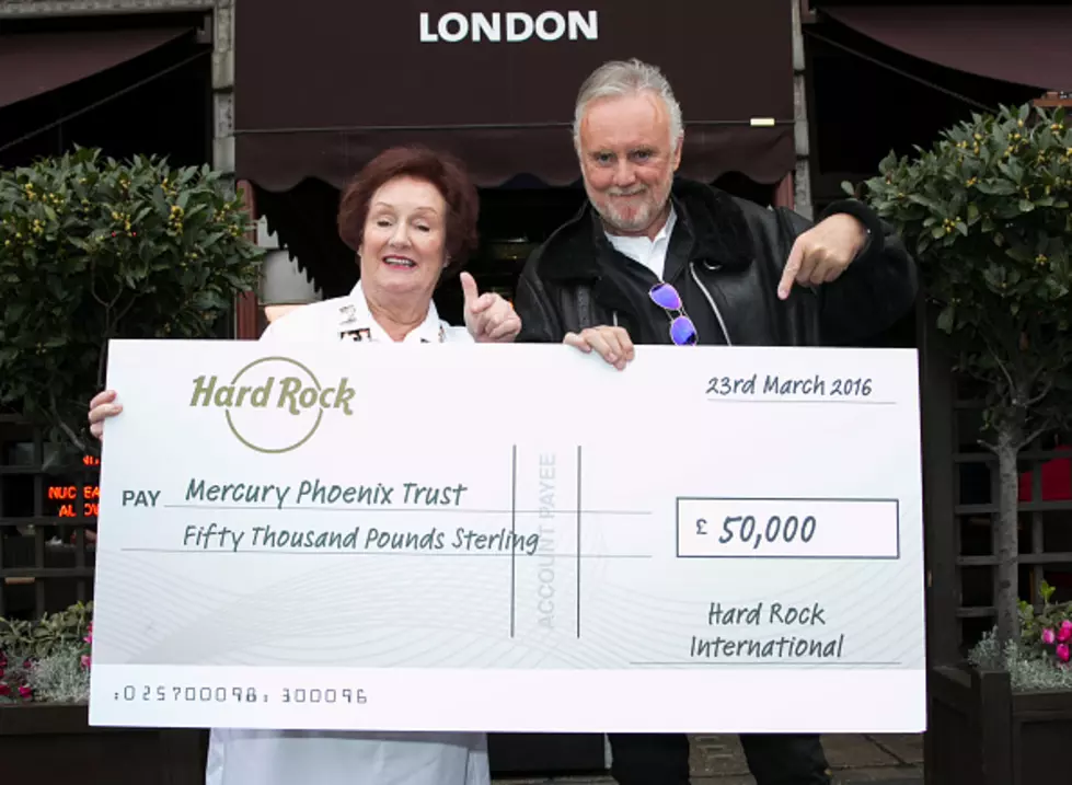 Queen’s Roger Taylor Accepts Check For Mercury Phoenix Trust