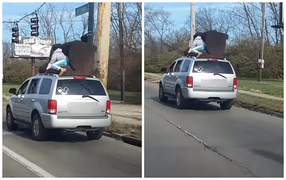 No Rope? Use A Dope – Guy Holds Down Couch On Top Of Moving Vehicle [VIDEO]