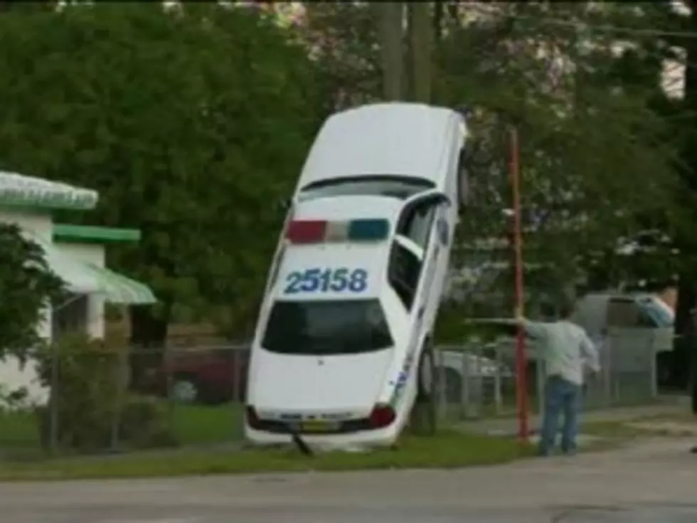 Distracted Cop Drove His Car Up A Pole Literally [VIDEO]