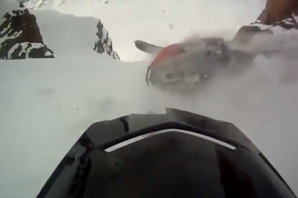 Man Falls Off Snowmobile – All The Way Down A Mountain [VIDEO]