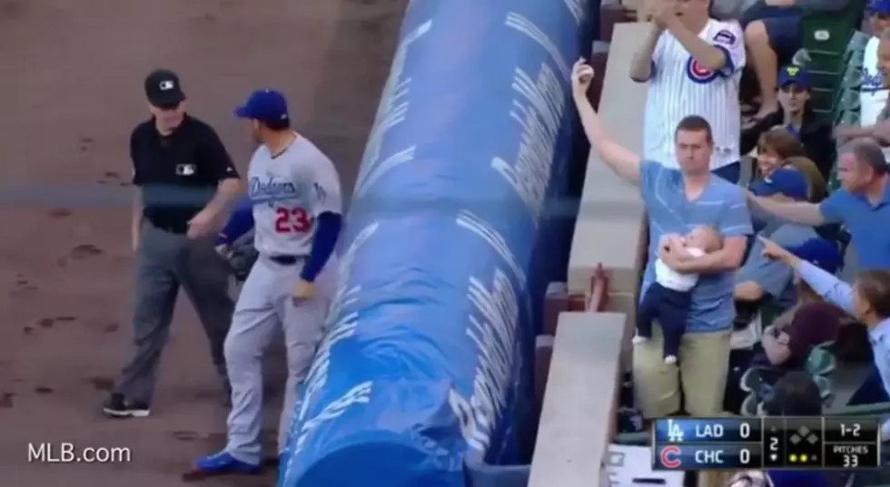 Cubs Fan Catches Foul Ball in One Hand, With Baby in the Other [VIDEO]