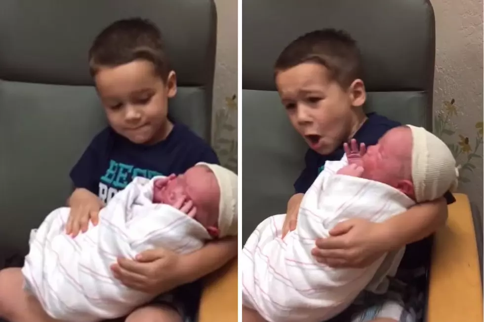 Baby Scares the Crap Out of his Big Brother When He Holds Him for the First Time [VIDEO]