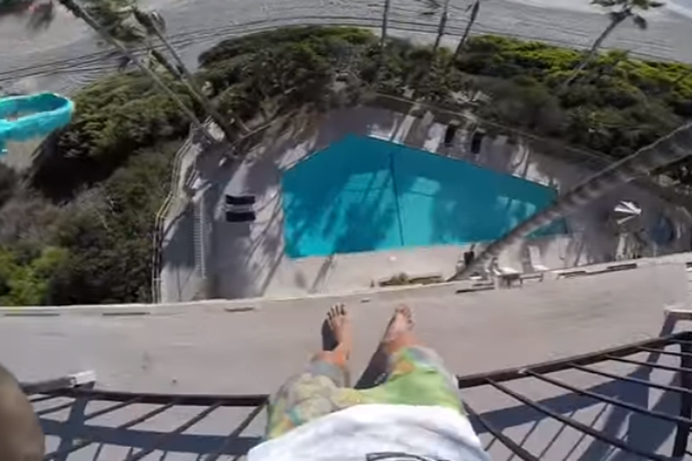 Dude Jumps Off 4th Floor Balcony into Swimming Pool [VIDEO]
