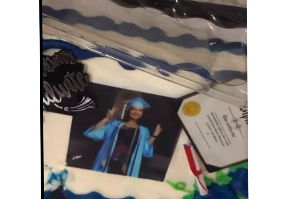 Family Gets One Helluva Surprise When They Cut Graduation Cake [VIDEO]
