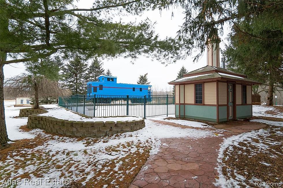 Love Original? This $2.1M Genesee County Estate Comes Complete with its Own Poolside Train Caboose